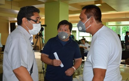 <p><strong>ENHANCED COMMUNITY QUARANTINE.</strong> Vice Governor Edward Mark Macias, Dumaguete Mayor Felipe Antonio Remollo, and Gov. Roel Degamo (from left to right) discuss salient points during Tuesday's consultation of the provincial Inter-Agency Task Force on Covid-19. Degamo later on signed Executive Order No. 2020-26 placing the province under enhanced community quarantine from April 3 to 18, 2020.<em> (Photo courtesy of Negros Oriental PIO)</em></p>