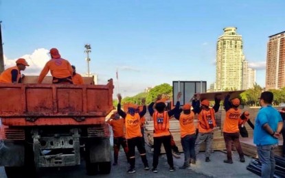 <p><strong>CONVERSION BEGINS. </strong>Workers of the Department of Public Works and Highways unload materials for the conversion of the Philippine International Convention Center (PICC) Forum Halls into a temporary facility for Covid-19 patients on Thursday (April 2, 2020). The agency said it eyes to operationalize the facility by next week. <em>(Photo courtesy of DPWH)</em></p>