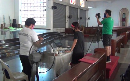 <p><strong>HOLY WEEK AT THE TIME OF COVID-19.</strong> Church workers set up the camera at the Metropolitan Immaculate Conception Cathedral in Zamboanga City in preparation for a live stream Palm Sunday mass. The Archdiocese of Zamboanga sets a modified observance of the Holy Week as a response to the coronavirus disease 2019 crisis. <em>(PNA photo by Teofilo P. Garcia, Jr.)</em></p>