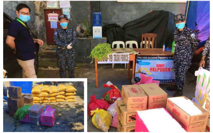 <p><strong>AID FOR JAILS.</strong> Lawyer Naguib Sinarimbo (left), minister of the Ministry of the Interior and Local Government-Bangsamoro Autonomous Region in Muslim Mindanao, facilitates the distribution of relief items to the Cotabato City Jail on Sunday (April 5, 2020). Aside from the city jail, the relief team also extended rice, vegetables, and canned goods items (inset) to the Maguindanao Provincial Jail situated in the city. <em>(Photo courtesy of READI-BARMM)</em></p>