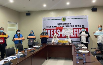<p><strong>HONORING FRONT-LINERS.</strong> Officials of the Bangsamoro Autonomous Region in Muslim Mindanao – Inter-Agency Task Force on Covid-19, led by BARMM health minister Dr. Safrullah Dipatuan (4th from left) and BARMM-IATF spokesperson Asnin Pendatun (2nd from right), display encouraging messages honoring health workers in the region and worldwide during the World Health Day observance on Tuesday (April 7, 2020). Aside from ensuring that regional health workers have proper support in the fight against the disease, the BARMM-IATF is also keen on providing the front-liners with hazard pay. <em>(Photo courtesy of BPI-BARMM)</em></p>