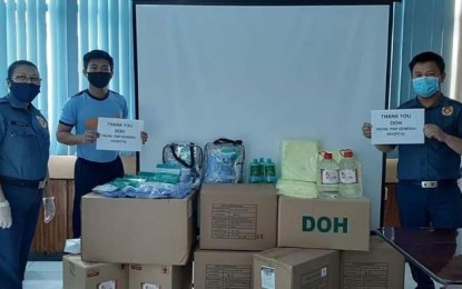 <p><strong>THANK YOU, DOH.</strong> Personnel from the PNP General Hospital receive medical supplies from the Department of Health (DOH) on Tuesday (April 7, 2020). These include PPE sets, N95 masks, alcohol, surgical gloves and isolation gowns to be distributed to PNP front-liners helping in the fight against the coronavirus disease 2019. <em>(Photo courtesy of PNP Public Information Office)</em></p>