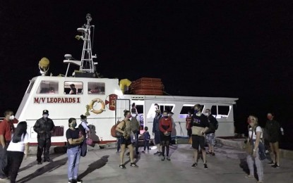 <p><strong>HOMEWARD BOUND.</strong> Thirteen stranded European tourists board a vessel at the Hilongos port in Leyte headed for Bohol on Saturday (April 11, 2020). The Department of Tourism in Eastern Visayas assisted the tourists reached Cebu City where they boarded a flight to Manila before proceeding to their home country.<em> (Photo courtesy of DOT Region 8)</em></p>