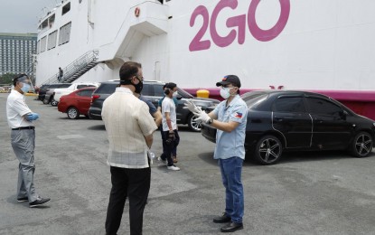 <p><strong>OCULAR INSPECTION.</strong> Senator Bong Go (right) talks with House Speaker Alan Peter Cayetano during the ocular inspection of two 2GO ships at the South Harbor in Manila on Monday (April 13, 2020). The 2GO Company offered to convert its two ships into temporary floating patient care centers for coronavirus diseases patients. <em><strong>(Contributed photo)</strong></em></p>