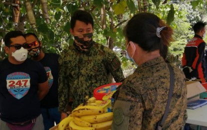 <p><strong>HELPING OUT.</strong> Reservists in Bukidnon volunteer to distribute relief goods to front-liners as soldiers are occupied manning the quality control points in the province. The province has one barangay on lockdown after a case was confirmed on April 9.<em> (Contributed photo)</em></p>