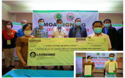 <p><strong>FUNDS TURNOVER.</strong> The Bangsamoro Autonomous Region in Muslim Mindanao donates over PHP14 million to the Cotabato Regional and Medical Center on Monday (April 13, 2020) to capacitate the hospital’s laboratory facility for 2019 coronavirus disease testing procedures. The initiative was sealed through a memorandum of agreement signing (inset) between BARMM chief minister Ahod Ebrahim (right) and CRMC chief of hospital, Dr. Helen Yambao (left) at the BARMM government center in Cotabato City. <em>(Photo by BPI-BARMM)</em></p>