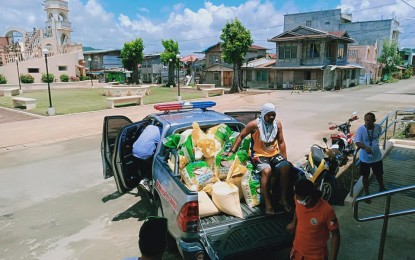 <p><strong>RELIEF GOODS.</strong> Local government workers prepare for the delivery of food packs to villages in Balangiga, Eastern Samar affected by a health crisis in this April 4, 2020 photo. The local government of Balangiga town on Monday (April 13, 2020) condemned the New People’s Army for “confiscating” relief goods from poor families in a far-flung village. <em>(Photo courtesy of Balangiga local government)</em></p>