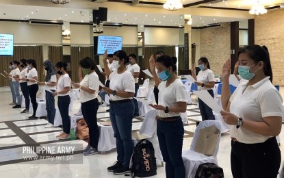 <p><strong>NEW ARMY NURSES.</strong> Newly-recruited nurses of the Philippine Army (PA) take their oath in Fort Bonifacio on Wednesday (April 15, 2020). These nurses will be assigned in various (PA) medical facilities that serve as patient care centers for coronavirus disease 2019 cases. <em>(Photo courtesy of Army Chief Public Affairs Office)</em></p>