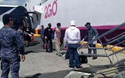 <p><strong>QUARANTINE SHIP. </strong>Overseas Filipino workers embark one of the quarantine ships operated by 2GO at Pier 15 in South Harbor, Manila. 2GO chairman Dennis Uy said the firm “had no plans of accepting” the government's offer to pay a PHP35 million fee for the operation of the quarantine ships. <em>(Contributed photo)</em></p>
