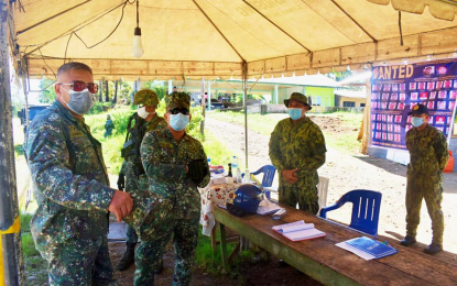 <p><strong>AUGMENTING SECURITY</strong>. Brig. Gen. Jonas Lumawag, 1st Marine Brigade commander (left) inspect one of the quarantine checkpoints of the 5th Marine Battalion Landing Team in Maguindanao on Friday, (April 17, 2020). The Marines expands its area of operation to include Cotabato City and the Bangsamoro Autonomous Region in Muslim Mindanao regional center as it takes over the role of Joint Task Force Central in securing the city.<em> (Photo courtesy of 6ID)</em></p>