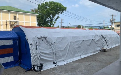 <p><strong>MOBILE FIELD HOSPITAL.</strong> A state-of-the-art mobile field hospital was assembled at the compound of the Bataan General Hospital and Medical Center (BGHMC) in Balanga City, Bataan on Sunday (April 19, 2020). The tent hospital is transferrable and can serve as isolation center for suspected Covid–19 cases. <em>(Photo courtesy of Bataan PIO)</em></p>