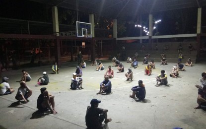 <p><strong>CURFEW VIOLATORS.</strong> Those caught outside of their homes beyond the curfew hours are gathered by the Iloilo City Police Office in La Paz district. Brig. Gen. Rene Pamuspusan, regional director of Police Regional Office 6 (Western Visayas), said on Monday (April 20, 2020) the curfew violators have reached 5, 181. <em>(PNA photo courtesy of ICPO-La Paz)</em></p>