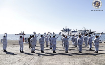 <p><strong>SEND-OFF.</strong> Navy troops hold a send-off ceremony for the BRP Bacolod City (LS-550) and its crew at the Captain Salvo Pier, Sangley Point, Cavite on Tuesday (April 21, 2020). The ship was deployed to pick up over 23,000 boxes containing personal protective equipment (PPE) sets procured by the government from China. <em>(Photo courtesy of Naval Public Affairs Office)</em></p>