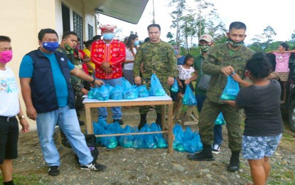 <p><strong>AID TO MANOBO FAMILIES.</strong> Some 70 Manobo families in Barangay New Umalag, San Miguel, Surigao del Sur, benefit from the food distribution conducted Monday (April 20, 2020) by the Army's 36th Infantry Battalion, in partnership with the Technical Education and Skills Development Authority, and farm school Montanez Agri-Venture. <em>(Photo courtesy of 36IB)</em></p>