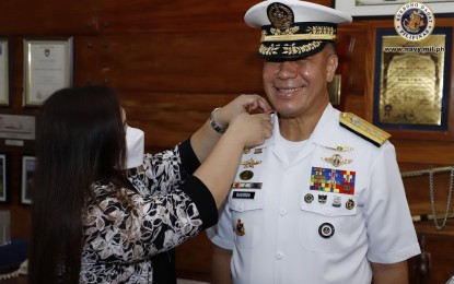 <p><strong>PROMOTION.</strong> Navy flag-officer-in-command Giovanni Carlo Bacordo (right) gets his 3-star rank as Vice Admiral donned by his wife Rachel (left) in a ceremony at the Philippine Navy headquarters in Manila on Wednesday (April 22, 2020). Bacordo also presided the donning ceremony for three other Navy officers who were promoted to the next higher rank. <em>(Photo courtesy of Naval Public Affairs Office)</em></p>