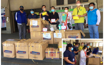 <p><strong>POSITIVE ENERGY.</strong> Staff members of the Aboitiz-owned Cotabato Light and Power Company (CLPC) hand over medical supplies to the Cotabato Regional and Medical Center (CRMC) on Wednesday (April 22, 2020) aimed at capacitating the frontliners in the fight against (COVID-19). Dr. Helen Yambao (inset), CRMC head director, signs the deed of donations as CLPC personnel look on. <em>(Photo courtesy of CLPC)</em></p>