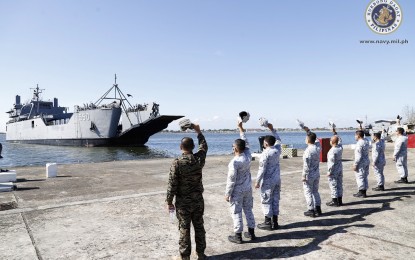 <p><strong>PPE PICK-UP MISSION.</strong> Navy troops hold a send-off ceremony for the BRP Bacolod City (LS-550) and its crew at the Captain Salvo Pier, Sangley Point, Cavite on Tuesday (April 21, 2020). The ship is expected to arrive in Xiamen, China on Sunday (April 26, 2020) to pick up over 23,000 boxes containing personal protective equipment (PPE) sets procured by the Philippine government. <em>(Photo courtesy of Naval Public Affairs Office)</em></p>