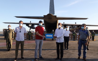 <p><strong>DONATION.</strong> Senator Sherwin Gatchalian (2nd from left) and Valenzuela 1st District Rep. Wes Gatchalian (left) turn over PHP30-million worth of medical supplies and personal protective equipment donated by their family to the National Task Force Covid-19 headed by Defense Secretary Delfin Lorenzana (3rd from left) at the Villamor Air Base, Pasay City on April 26, 2020. The Office of Civil Defense on Thursday (April 30, 2020) said it has sent the donation to its Mindanao hubs for the use of front-line health workers. <em>(Photo courtesy of AFP Public Affairs Office)</em></p>