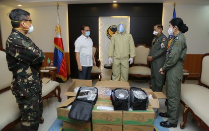 <p><strong>DONATION.</strong> Officials from the Philippine Air Force receive the first batch of medical supplies and personal protective equipment (PPE) sets donated by the Clark Development Corporation (CDC) and the Clark Investors and Locators Association (CILA) and intended for its medical front-liners on Monday (April 27, 2020). The donation contains safety goggles, medical gloves, isolation face shields, SKN95 particulate respirator, isolation waterproof clothing, shoe cover, and cover-all protective suits. <em>(Photo courtesy of Air Force Public Affairs Office)</em></p>