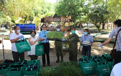 <p><strong>LIVELIHOOD PROGRAM.</strong> Agriculture Secretary William Dar (in blue polo shirt) and AFP Vice Chief-of-Staff, Vice Admiral Gaudencio C. Collado Jr. (2nd from right), lead the launch of livelihood projects for soldiers and their dependents in Camp Aguinaldo, Quezon City on Tuesday (April 28, 2020). The Urban Agriculture Program, or ALPAS (Ahon Lahat, Pagkaing Sapat Kontra sa Covid-19), aims to ensure the availability and sustainability of food and provide an alternative livelihood during the enhanced community quarantine. <em>(Photo courtesy of AFP Public Affairs Office)</em></p>