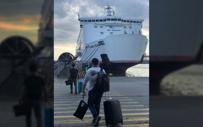 <p><strong>FILIPINO VESSEL.</strong> Passengers board the passenger vessel/RoRo St. Michael Archangel in this undated photo. The Department of Transportation on Wednesday (May 22, 2024) announced the country's inclusion in the International Maritime Organization White List, proving the status of the country's seafarers in the international stage.<em> (Photo courtesy of MARINA)</em></p>