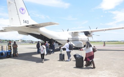 <p><strong>FERRIED.</strong> Twenty-six foreigners board the military's C-295 medium transport plane upon its return on Wednesday (April 29, 2020) to Pasay City, Metro Manila from the Edwin Andrews Air Base (EAAB) in Zambonga City. They were stranded following the imposition of the enhanced community quarantine amid the Covid-19 crisis. The plane transported on the same day medical supplies and stranded soldiers and a physician coming from Manila. <em>(Photo courtesy of Wesmincom Public Information Office)</em></p>