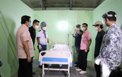 <p><strong>PATIENT CARE CENTER</strong>. (L-R) Bulacan Vice Governor Wilhelmino "Willy" Sy-Alvarado, Iglesia Ni Cristo Official, and Maligaya Development Corp. Chief Operating Officer Atty. Glicerio "Ka GP" Santos IV, DPWH Undersecretary Emil Sadain, National Task Force COVID-19 chief implementer and Presidential Peace Adviser Sec. Carlito Galvez Jr., Bulacan 1st District Rep. Jose Antonio Sy-Alvarado, Presidential Adviser for Flagship Programs and Projects and BCDA President and CEO Secretary Vince Dizon, and Philippine Coast Guard Commandant Admiral Joel Garcia, inspect one of the cubicles in the We Heal as One Center (WHAOC)-Philippine Arena on Thursday (April 30, 2020). The patient care center has an initial capacity of 300 beds and will be manned by 50 medical personnel from the Department of Health.<em> (Photo courtesy of BCDA)</em></p>