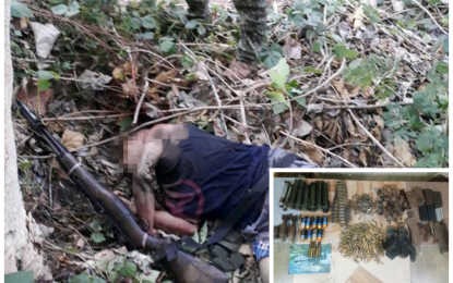 <p><strong>NEUTRALIZED.</strong> The body of a fallen member of an armed lawless group following an encounter in remote Barangay Laguilayan, Isulan, Sultan Kudarat on Thursday (April 30, 2020). Government troopers also recovered a cache of firearms, explosives, and ammunition (inset) left behind by other members of the lawless band who fled following a 20-minute firefight with the soldiers. <em>(Photos courtesy of 6ID)</em></p>