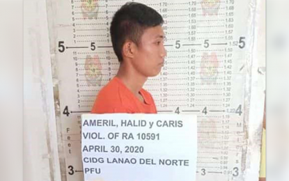 <p><strong>ARRESTED.</strong> A team of soldiers and policemen arrest Halid Ameril, an alleged member of the Rhapkhar crime group, on Thursday (April 30, 2020) in Barangay Dansalan, Sapad, Lanao del Norte. The suspect is believed involved in gun-for-hire and smuggling in the province.<em> (Photo courtesy of WesMinCom PIO)</em></p>