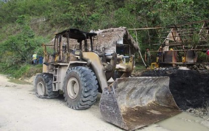 <p><strong>SET ON FIRE</strong>. One of the seven heavy equipment torched at a limestone quarry site in a remote village in Camalig town, Albay province Monday night (May 4, 2020). Police investigators are still looking into the incident to determine whether the burning was insurgency related or perpetrated by a crime syndicate. <em>(Photo courtesy of Maj. Malu Calubaquib/Police Regional Office-5)</em></p>