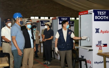 <p><strong>MEGA SWABBING CENTER.</strong> Cabinet officials lead the inspection of the country's second mega swabbing center at the Enderun Tent in Taguig City on Wednesday (May 6, 2020). The swabbing center can conduct 1,000 to 1,500 swab tests daily, boosting the country’s health system capacities to detect, isolate, and treat Covid-19 patients. <em>(Photo courtesy of DND Public Affairs Service)</em></p>