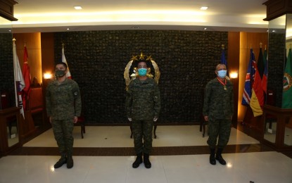 <p><strong>NEW AFPETDC ACTING CHIEF. </strong>AFP spokesperson, Marine Brig. Gen. Edgard Arevalo (left) takes over as the acting chief of the AFP Education, Training, and Doctrine Command (ETDC) in a turn over ceremony led by vice chief-of-staff, Vice Adm. Gaudencio Collado Jr. (center) on Wednesday (May 6, 2020). Arevalo replaces Rear Adm. Adeluis Bordado (right), who will be assigned as the chief-of-naval staff. <em>(Photo courtesy of AFP Public Affairs Office)</em></p>