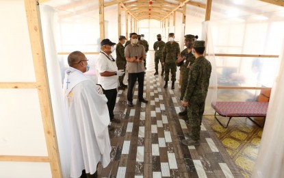 <p><strong>PATIENT CARE CENTERS.</strong> Armed Forces of the Philippines officials and private stakeholders take a look at the newly-constructed patient care center (PCC) at the Emmanuel Hospital in San Miguel, Bulacan on April 25, 2020. The AFP and its partners from the private sector have constructed 29 PCCs for Covid-19 patients since March 28. <em>(Photo courtesy of AFP Public Affairs Office)</em></p>