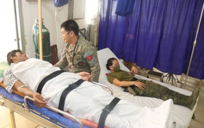 <p><strong>HUMANE ACT</strong>. A military physician attends to Ka Lando, a wounded New People's Army rebel rescued by government troops on Wednesday (May 6, 2020) in Barangay Guibo, Siayan, Zamboanga del Norte. Private First Class Eunice Jane Curayag of the 1st Civil Military Operations Battalion on Thursday (May 7, 2020) has donated blood to Ka Lando while undergoing medical treatment at Kuta Cesar Sang-an Station Hospital in Labangan, Zamboanga del Sur. <em>(Photo courtesy of Army 1st Infantry Division PAO)</em></p>