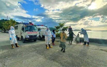 <p><strong>NEW COVID-19 CASES.</strong> Local health workers disinfect the ambulances used in transporting suspected carriers of Covid-19 in Tarangnan, Samar. The Department of Health on Friday (May 8, 2020) reported five new confirmed infections in the municipality, bringing its total cases to 14. <em>(Photo courtesy of Tarangnan fire station)</em></p>