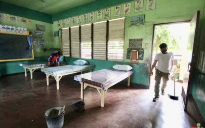 <p><strong>MORE ISOLATION CENTERS.</strong> A school worker cleans a classroom in the Cebu City Central School which is among the 19 Barangay Isolation Centers to cater to asymptomatic Covid-19 patients. Mayor Edgardo Labella on Saturday (May 9, 2020) ordered the activation of more barangay isolation centers as the Covid-19 cases in Cebu City rose to 1,434. <em>(Photo courtesy of Cebu City PIO)</em></p>