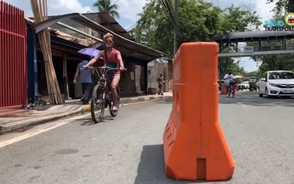 <p><strong>BIKE LANES.</strong> The Pasig City Transportation Department starts the road works for the pop-up bike lanes and sidewalk extensions on Sunday (May 10, 2020.) Earlier, the local transport department declared "biking" as an essential mode of transportation in the city. <em>(Screengrab from Pasig City Public Information Office Facebook page)</em></p>