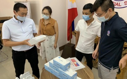 <p><strong>MOLECULAR LABORATORY.</strong> Governor Arthur Yap (left) receives boxes of face masks, gallons of alcohol, and disinfectants donated by members of the Bohol Chinese Chamber of Commerce intended for the front-liners in the province. Yap on Monday (May 11, 2020) said Bohol is 50-percent away from getting approval to operate a molecular laboratory that can conduct coronavirus disease 2019 (Covid-19) testing at the Gov. Celestino Gallares Memorial Hospital. <em> (Photo courtesy of Gov. Arthur Yap)</em></p>