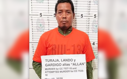<p><strong>BUSTED.</strong> A team of police operatives arrest Lando G. Turaja, an alleged member of the communist New People's Army in the Surigao del Sur town of Lianga on Sunday (May 10, 2020). Turaja, 50, has standing warrants of arrest for murder and frustrated murder. <em>(Photo courtesy of PRO-13 Information Office)</em></p>