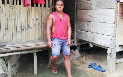 <p><strong>HOME AT LAST.</strong> Elwin Aralar, 25, stands outside their house in upland Pansud village, La Paz, Leyte in this undated photo. After walking for four days and quarantined for seven weeks due to movement restrictions, he finally arrived home on May 9, 2020. <em>(PNA photo by Sarwell Meniano)</em></p>