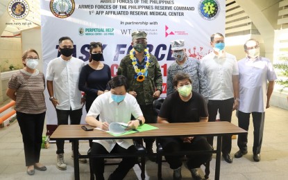 <p><strong>PATIENT CARE CENTER.</strong> Representatives from the Armed Forces of the Philippines and private sector partners witness the turn-over of an emergency quarantine facility by Navy troops to the Perpetual Help Medical Center in Las Piñas City on May 11, 2020. The facility has a total capacity of 16 beds and could accommodate patients who have mild to no symptoms of the coronavirus disease 2019 (Covid-19). <em>(Photo courtesy of Naval Public Affairs Office)</em></p>
