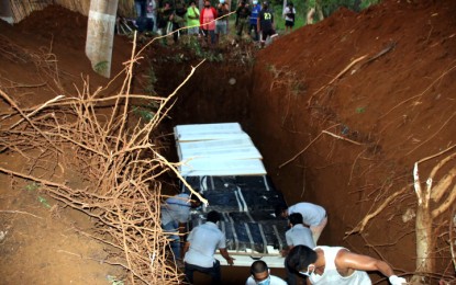 <p><strong>DECENT BURIAL.</strong> The Philippine Army gives a decent burial to nine of the 10 communist New People’s Army rebels Wednesday (May 13, 2020) in a public cemetery in Sitio Lingcomonan, Barangay Binakalan, Gingoog City. The 10 rebels were killed during the series of clashes that took place in the border of the Agusan del Norte and Misamis Oriental provinces on May 10, 2020. <em>(PNA photo by Alexander Lope</em>z)</p>
