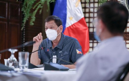 <p><strong>MEETING WITH IATF</strong>. President Rodrigo Roa Duterte holds a meeting with members of the Inter-Agency Task Force on the Emerging Infectious Diseases (IATF-EID) at the Malago Clubhouse in Malacañang on May 11, 2020. Malacañang on Saturday (May 16, 2020) said Duterte is expected to return to Manila before Tuesday to attend another meeting with IATF-EID members on the coronavirus. <em>(Presidential photo by Ace Morandante)</em></p>