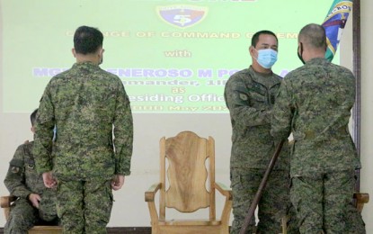 <p><strong>CHANGE OF COMMAND.</strong> Maj. Gen. Generoso Ponio (2nd from right), 1st Infantry Division commander, hands over the command flag to Lt. Col. Romulus Rabara (right, back to the camera), as the new commander of the 5th Infantry Battalion during a ceremony held in Camp Cesar Sang-an in Labangan, Zamboanga del Sur on Monday (May 18, 2020). Rabara replaces Maj. Jasper Brix Perez (left, back to the camera). <em>(Photo courtesy of 1st Infantry Division)</em></p>