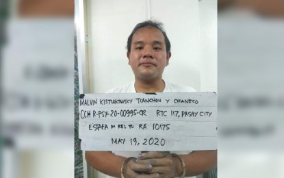 <p><strong>NABBED.</strong> Authorities arrest Malvin Kistiakowsky Tianchon for engaging in cryptocurrency trading scam in Parañaque City on Tuesday (May 19, 2020). Another suspect, Kli Ban Rapista Agarrado, was arrested in Taguig City for alleged credit card fraud. <em>(Photo courtesy of NCRPO)</em></p>