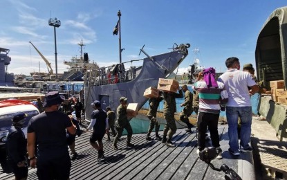 <p><strong>MORE FOOD AID.</strong> Army and navy personnel unload relief goods from a military vessel in Tacloban port on Tuesday (May 19, 2020). Some 26,250 additional family food packs from Cebu City have been delivered for Typhoon "Ambo" (Vongfong) victims in Samar provinces. <em>(Photo courtesy of Office of the Civil Defense Region 8)</em></p>