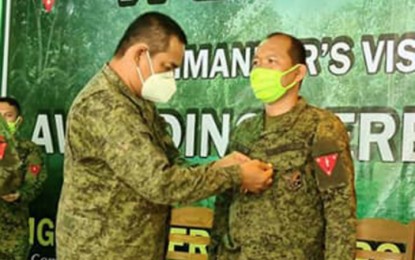 <p><strong>MERITORIOUS ACHIEVEMENTS.</strong> Maj. Gen. Generoso Ponio, commander of the 1st Infantry Division, leads the awarding of merit medals to an officer and five enlisted men during his visit Wednesday (May 20, 2020) in Camp Sabido that houses the headquarters of the 53rd Infantry Battalion in Guipos, Zamboanga del Sur. The awardees are cited for their recent accomplishment against the New People's Army rebels in the province.<em> (Photo courtesy of the 1st Infantry Divison)</em></p>