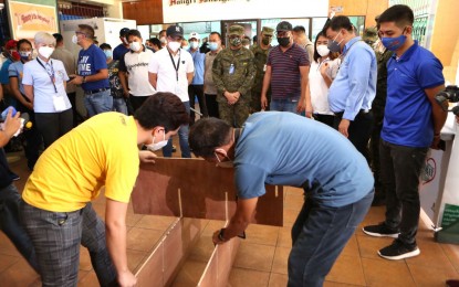 <p><strong>PATIENT CARE CENTER.</strong> AFP Chief-of-Staff, Gen. Felimon Santos Jr. and Manila Mayor Francisco "Isko Moreno" Domagoso (in white polo shirt) grace the turnover of two emergency quarantine facilities (EQFs) at Tondo High School in Manila on Thursday (May 21, 2020). The EQFs have a 44-bed capacity and will accommodate suspect and probable coronavirus disease 2019 (Covid-19) patients. <em>(Photo courtesy of AFP Public Affairs Office)</em></p>