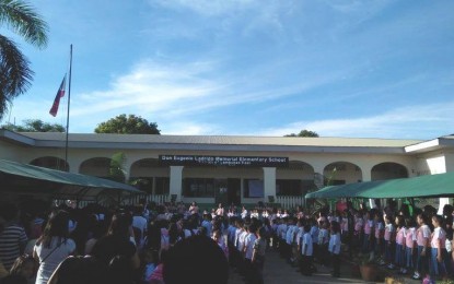 <p><strong>BACK TO SCHOOL.</strong> Students of an elementary school in Iloilo town attend their first flag-raising ceremony in June last year. The Department of Education is eyeing to open classes for the school year 2020-2021 on August 24.<em> (PNA file photo)</em></p>