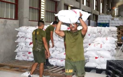 <p><strong>ACTIVE PARTICIPATION.</strong> Government troops belonging to the Army's 402nd Infantry Brigade assist in transporting sacks of rice intended for families affected by the coronavirus disease crisis. The brigade has conducted 2,231 Covid-19 checkpoints, and extended 1,214 security assistance and participated in relief operations in Caraga Region from April 15 to May 15 this year. <em>(Photo courtesy of 402nd IBde)</em></p>